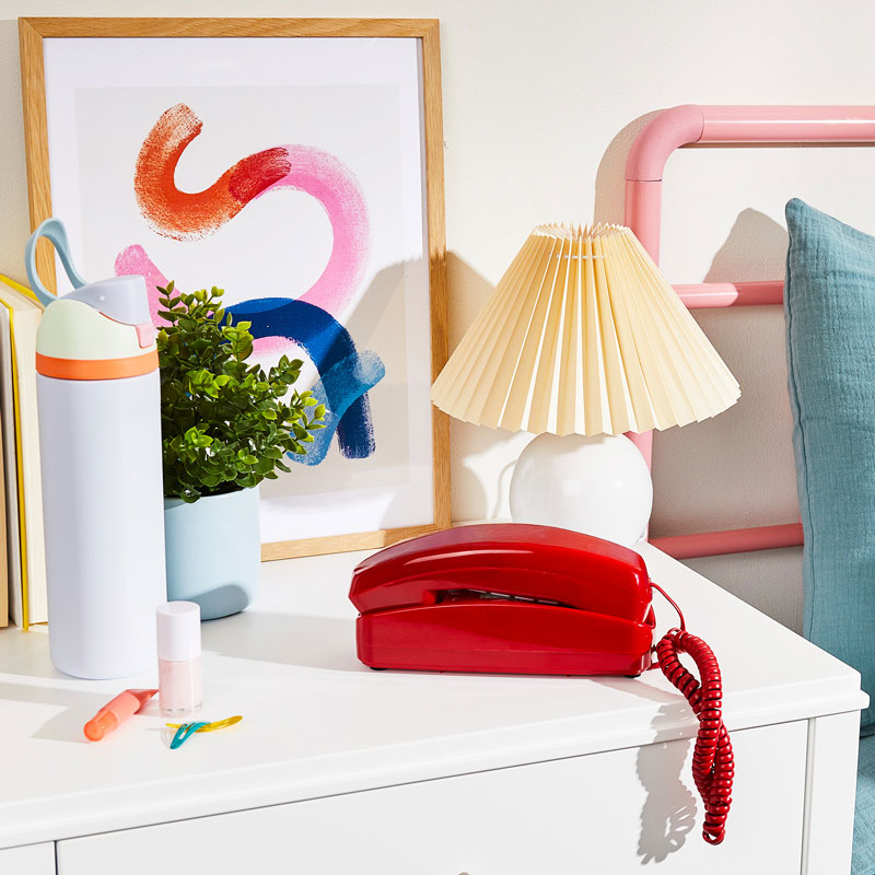 An image of Ooma Telo with Retro White Phone on a table.