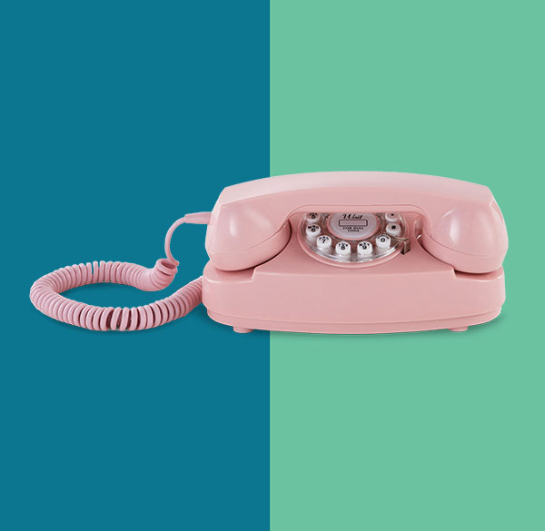 Ooma Retro Princess Phone against blue and green backdrop.