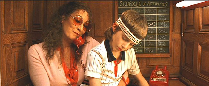 Etheline Tenenbaum is on the phone with son in her lap