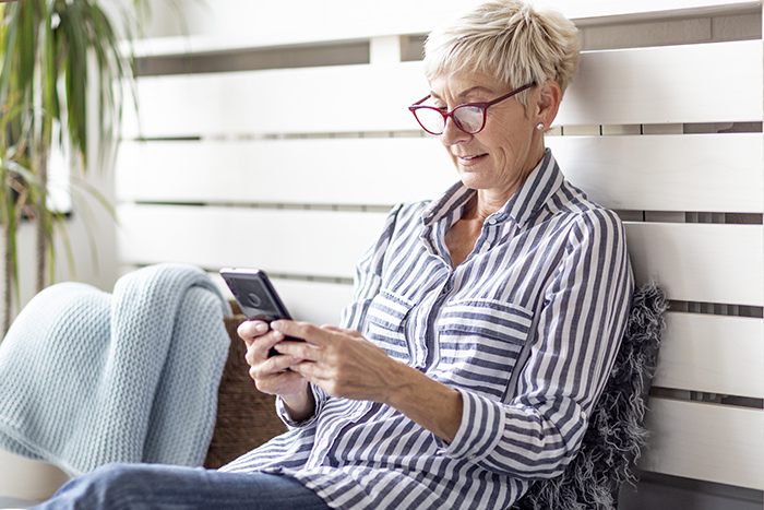 Seated woman using a cell phone