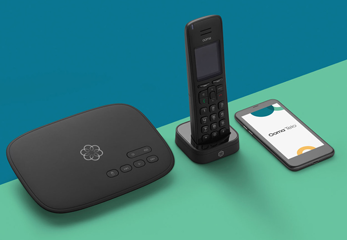 Ooma Telo home phone, base station and cell phone with Ooma Telo app
