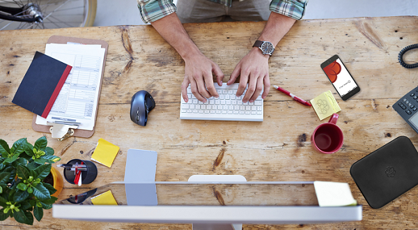 Working at office desk.