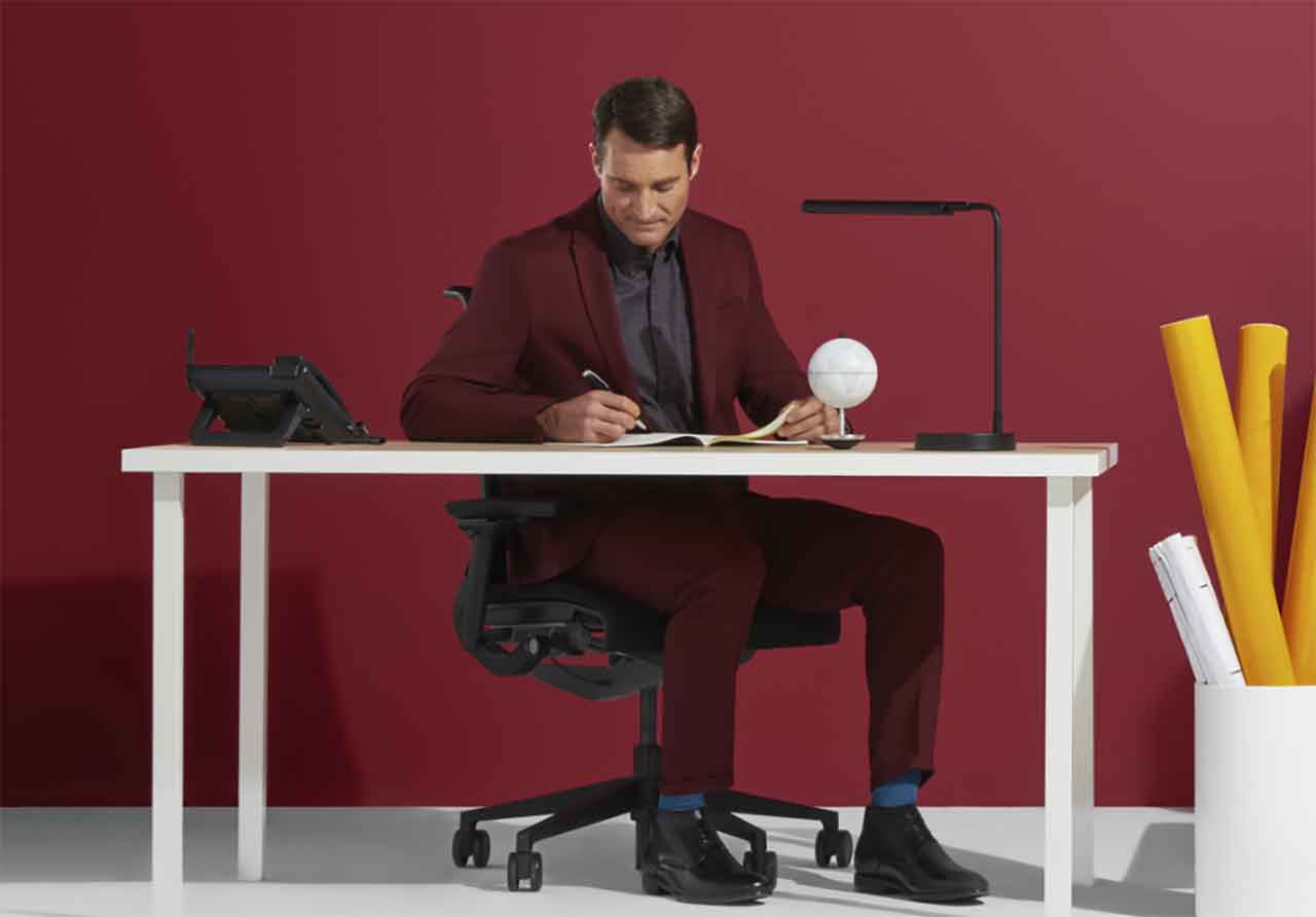 Man in suit working at a desk